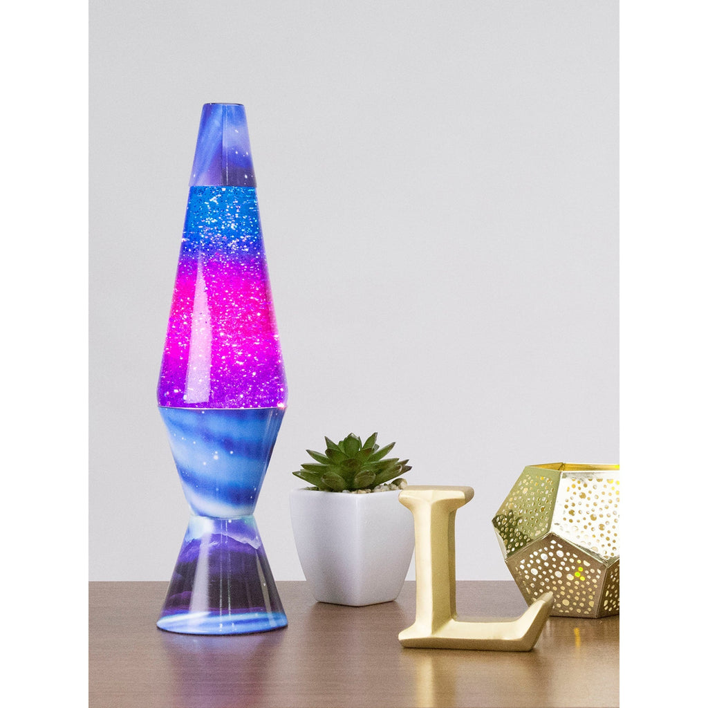 14.5" LAVA� Lamp Colormax Northern Lights - Glitter on a table with a succulent and a candle